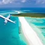 Airplane Soaring Over Tropical Islands