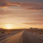 A lone car driving on a desert highway