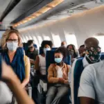 Passengers wearing masks on an airplane