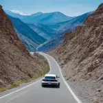 A scenic road winding through a mountainous landscape