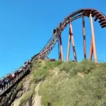 Roller coaster slowly ascending a hill