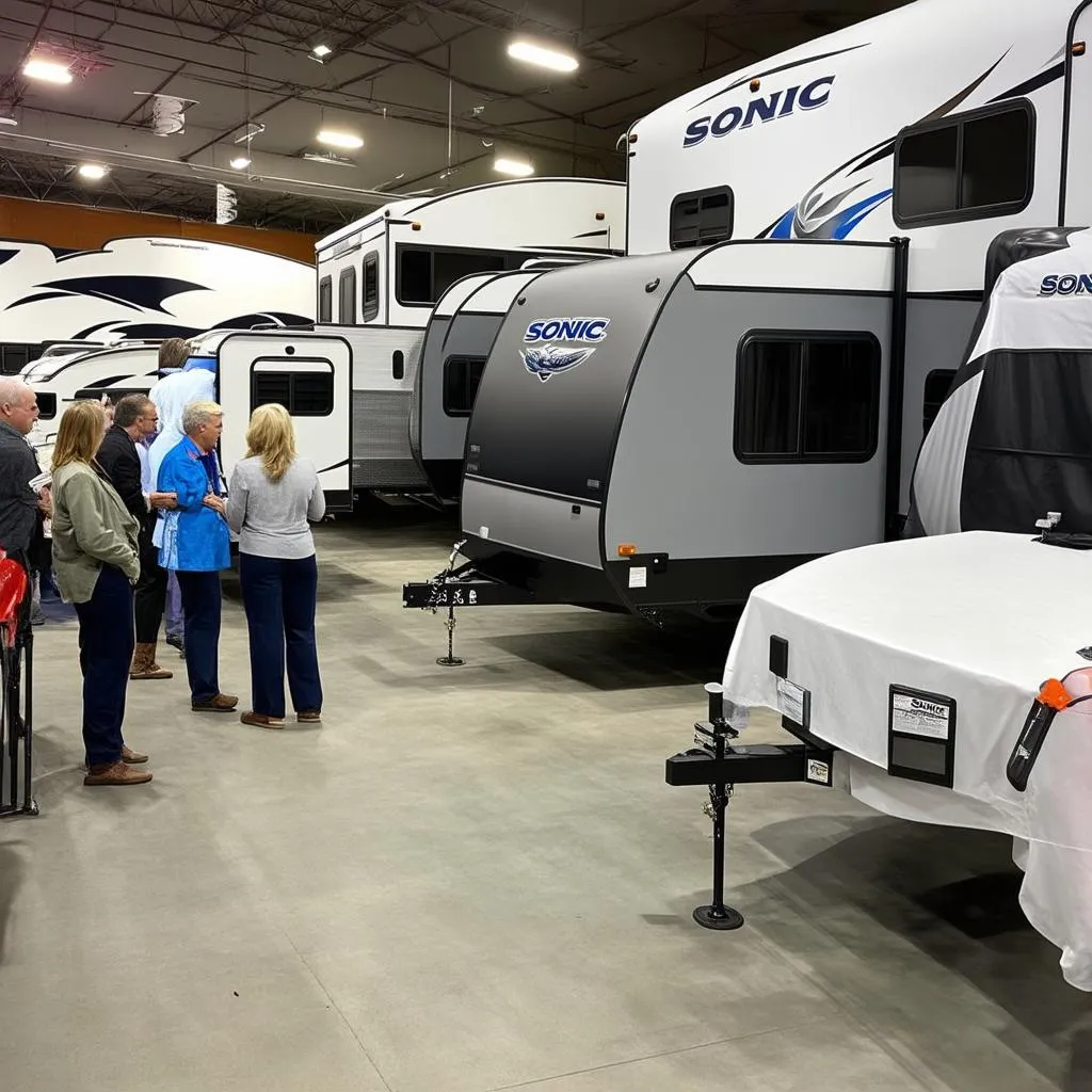 Modern RV dealership with Sonic travel trailers on display