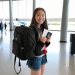 Teenage girl with backpack at the airport