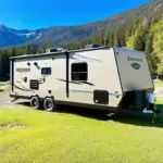 Travel Trailer Parked at a Scenic Campsite