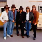 The Traveling Wilburys posing together.