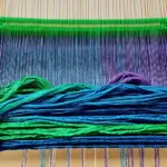 Colorful threads on a weaving loom