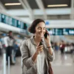 woman talking on the phone at the airport