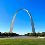 The iconic Gateway Arch in St. Louis, Missouri, against a clear blue sky.