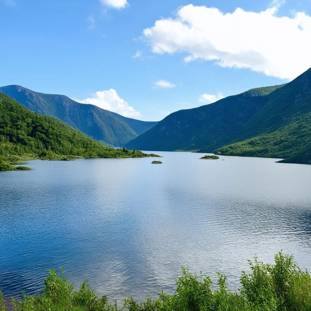 Tranquil waters of Son La Reservoir surrounded by lush mountains.