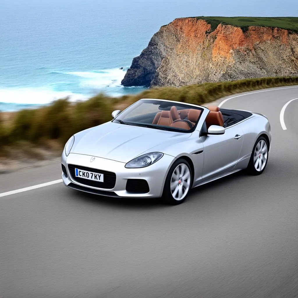 A car driving on a winding road along the coast