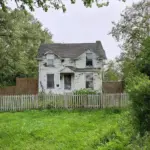 old house with overgrown garden