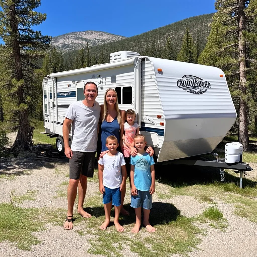 Family camping trip in a travel trailer