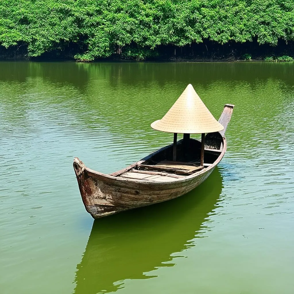 Traditional Vietnamese fishing boat on Hoa Trung Lake