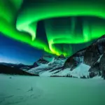 Northern Lights over snow-covered mountains