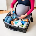 pregnant woman packing suitcase