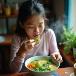 Hanoi woman enjoying green papaya soup