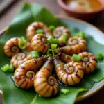 Grilled snails with green onion oil in Hanoi