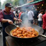 Hanoi street food vendor preparing fried chicken