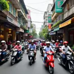 Busy Hanoi street scene with scooters and shops