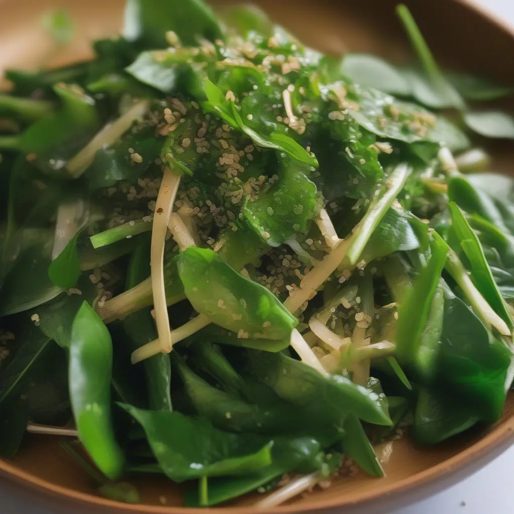 A plate of morning glory stir-fry garnished with fresh ngo gai