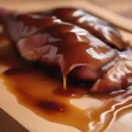 Peking duck with crispy, honey-glazed skin.