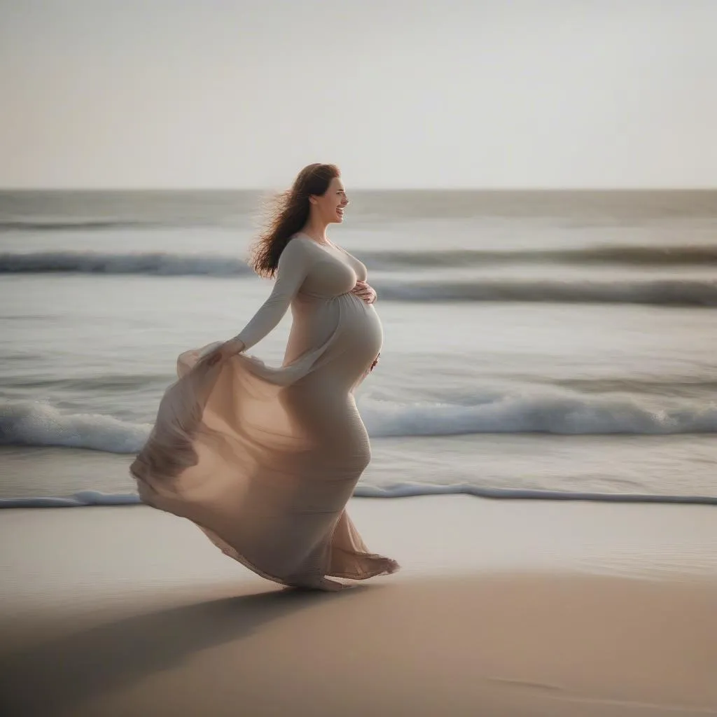 Pregnant woman walking on a beach