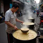 Hanoi street food vendor preparing alu