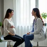 Pregnant woman consulting with doctor in Hanoi