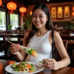 Pregnant woman enjoying fresh Gỏi Cuốn in a Hanoi restaurant