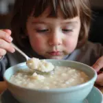 Child Eating Bland Food After Vomiting