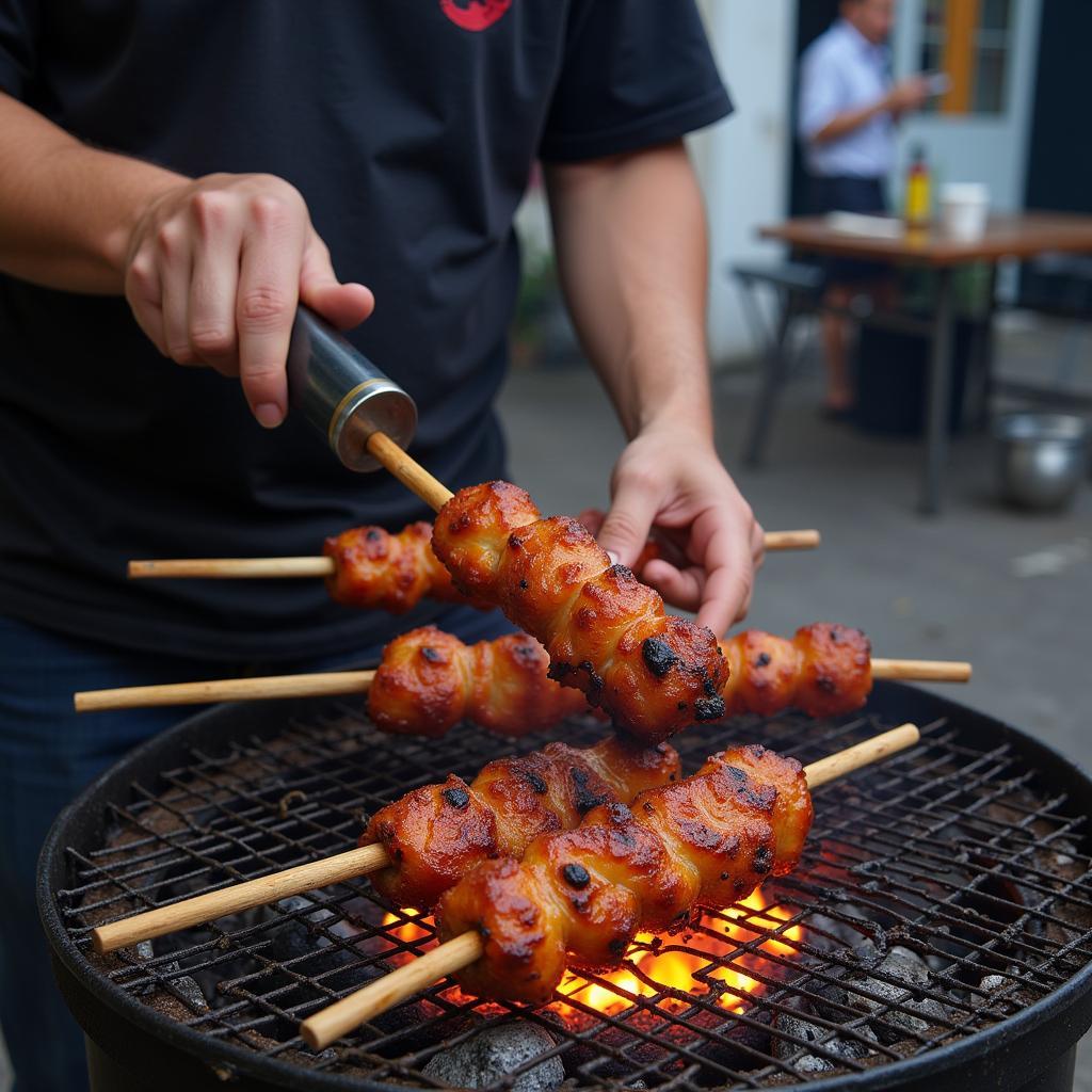 Hanoi street food vendor grilling ca o kiem skewers.