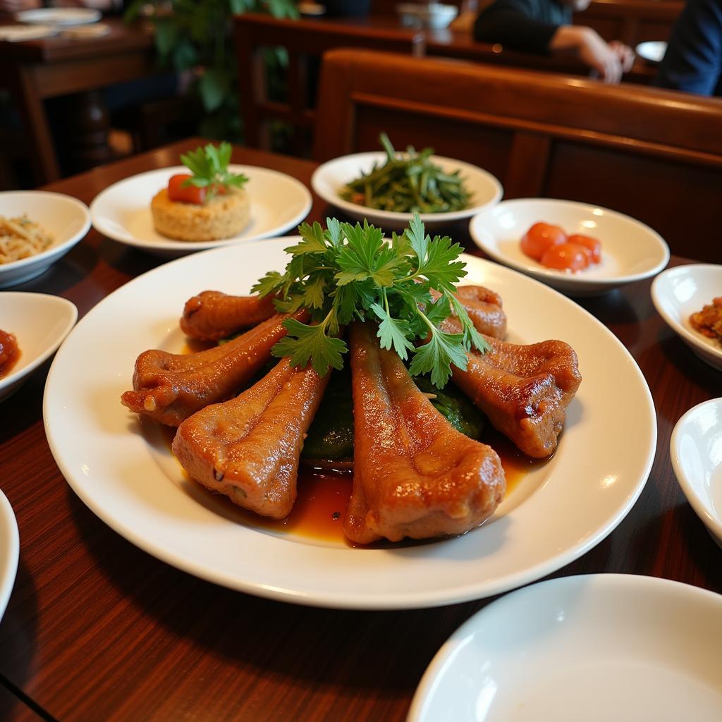 A plate of pork knuckle served in a traditional Hanoi restaurant