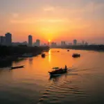 Panoramic view of Hanoi's West Lake at sunset with traditional boats.