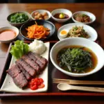 A traditional Korean meal featuring seaweed soup, bulgogi, and various banchan.