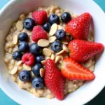 Oatmeal topped with fresh berries and a sprinkle of chopped nuts