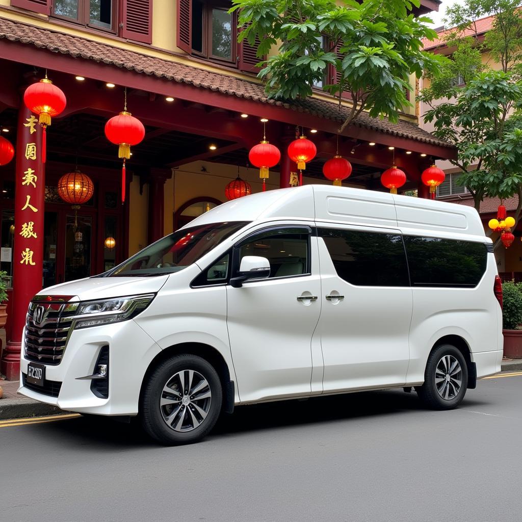 TRAVELCAR van parked in front of a Chinese restaurant in Hanoi's Old Quarter