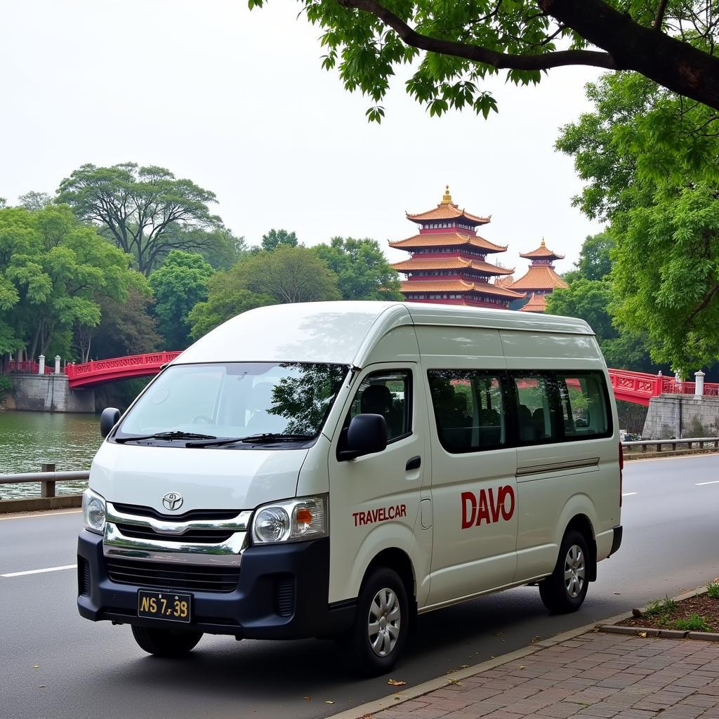 TRAVELCAR van parked near a Hanoi landmark, ready for a culinary tour.