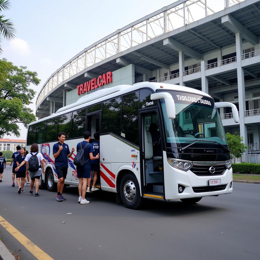 TRAVELCAR Hanoi Transport:  A TRAVELCAR bus transporting football fans to a match in Hanoi.